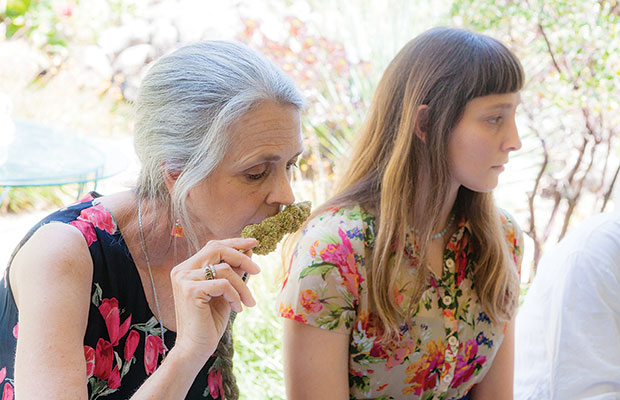 Nikki smelling cannabis bud